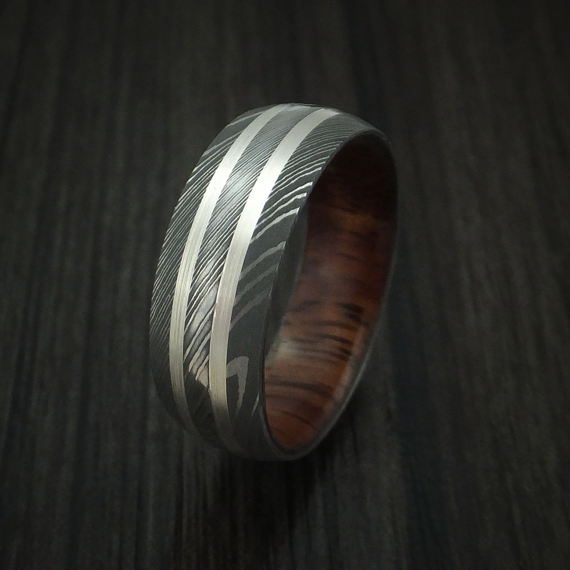 Damascus Steel Men's Ring with Silver Inlays and Koa Hard Wood Sleeve - Image 4