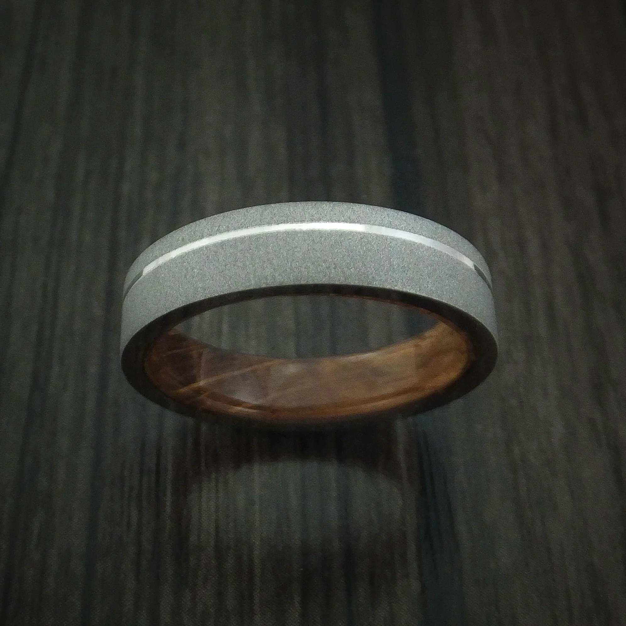 Titanium Men's Ring with Platinum Inlay and Whiskey Barrel Wood Sleeve - Image 2