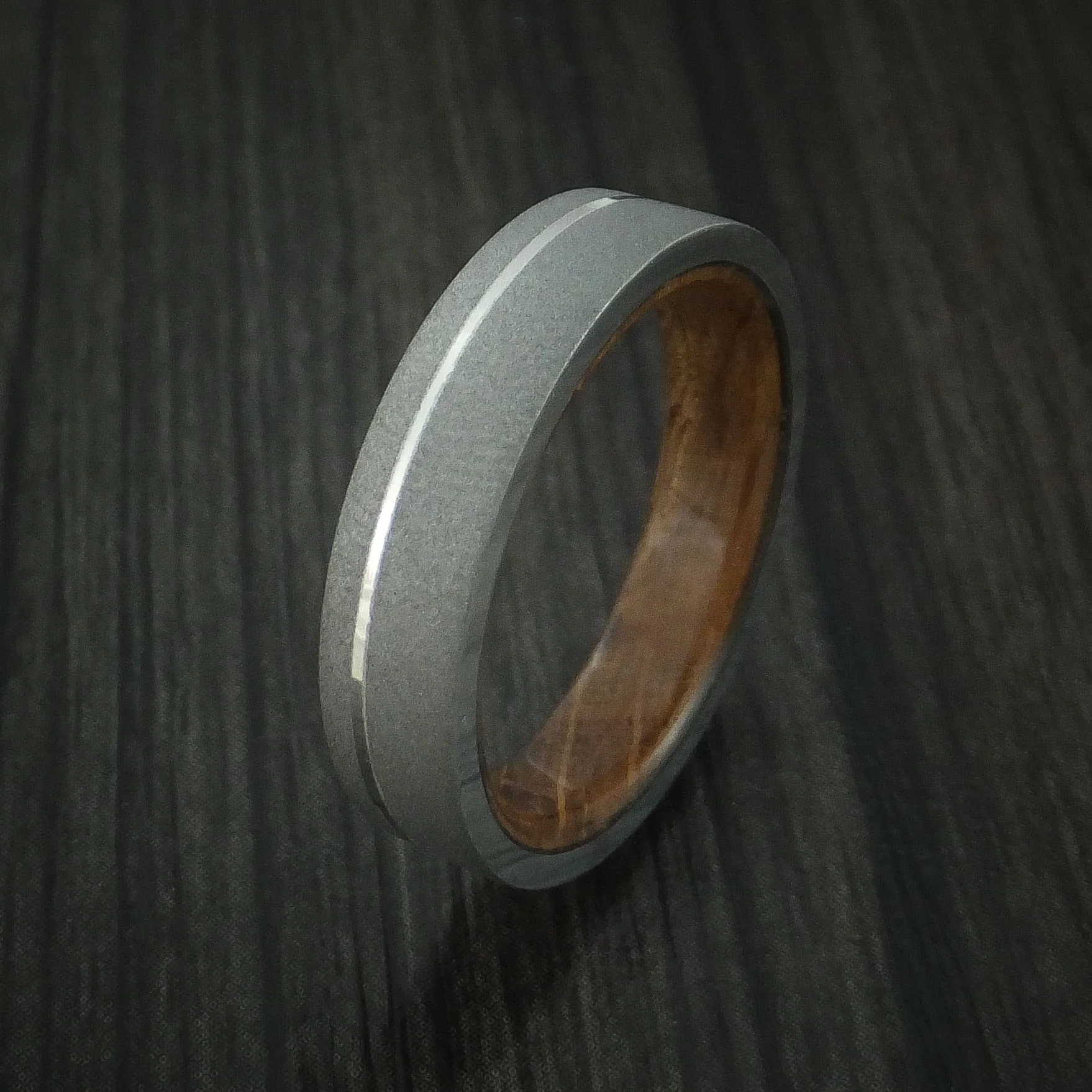 Titanium Men's Ring with Platinum Inlay and Whiskey Barrel Wood Sleeve - Image 4